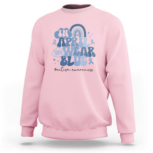 Autism Awareness Sweatshirt In April We Wear Blue Rainbow Retro Groovy TS01 Light Pink Printyourwear