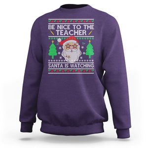 Be Nice To The Teacher Santa Is Watching Claus Ugly Christmas Sweatshirt TS02 Purple Printyourwear