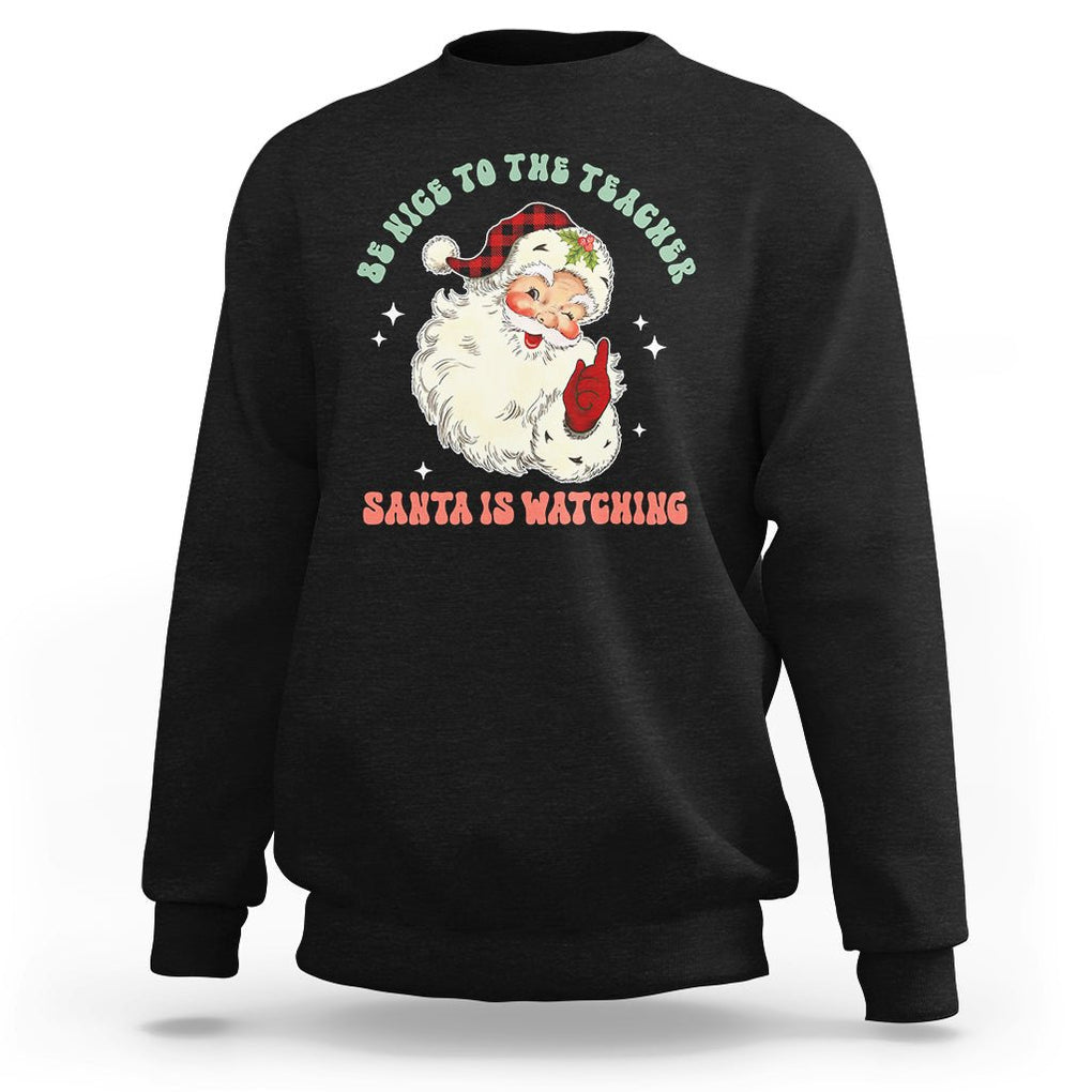 Be Nice To The Teacher Santa Is Watching Retro Groovy Christmas Sweatshirt TS02 Black Printyourwear