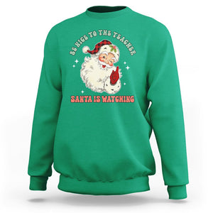 Be Nice To The Teacher Santa Is Watching Retro Groovy Christmas Sweatshirt TS02 Irish Green Printyourwear