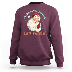 Be Nice To The Teacher Santa Is Watching Retro Groovy Christmas Sweatshirt TS02 Maroon Printyourwear