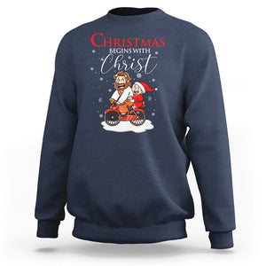 Christmas Begins With Christ Jesus Santa Riding Bicycle Sweatshirt TS09 Navy Printyourwear