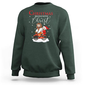 Christmas Begins With Christ Jesus Santa Riding Bicycle Sweatshirt TS09 Dark Forest Green Printyourwear