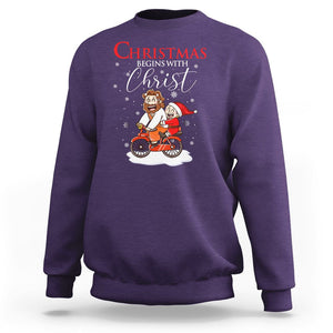 Christmas Begins With Christ Jesus Santa Riding Bicycle Sweatshirt TS09 Purple Printyourwear