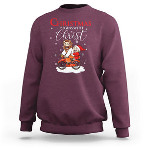 Christmas Begins With Christ Jesus Santa Riding Bicycle Sweatshirt TS09 Maroon Printyourwear