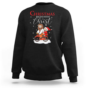 Christmas Begins With Christ Jesus Santa Riding Bicycle Sweatshirt TS09 Black Printyourwear