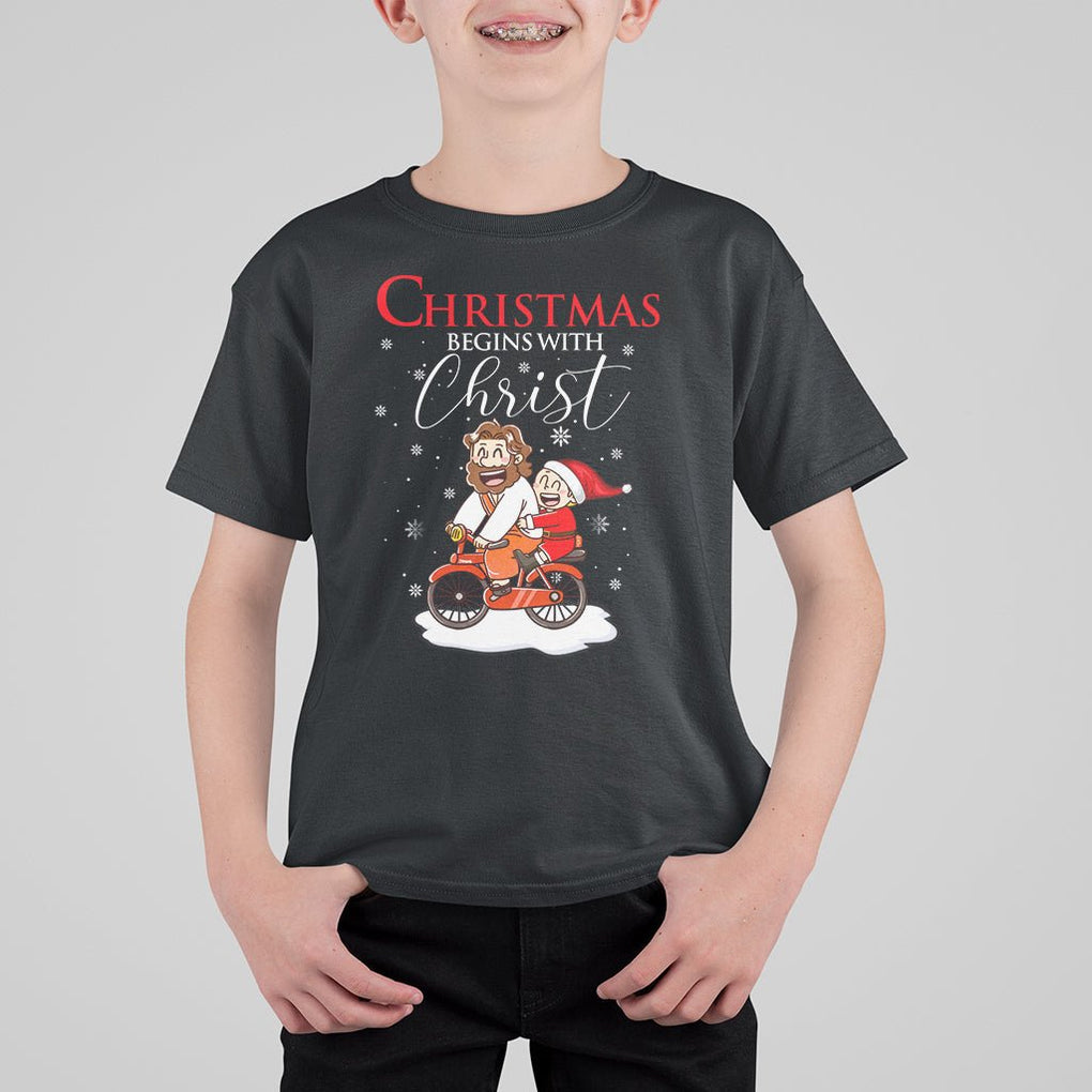 Christmas Begins With Christ Jesus Santa Riding Bicycle T Shirt For Kid TS09 Black Printyourwear