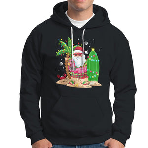 Christmas In Hawaii Hoodie Flamingo Float Xmas Palm Tree Surfboard Cute Santa At Beach TS09 Black Printyourwear