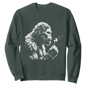 Bigfoot Blowing Dandelion Flower Graphic Sweatshirt Whimsical Sasquatch Profile Artistic Vintage Distressed TS02 Dark Forest Green Print Your Wear