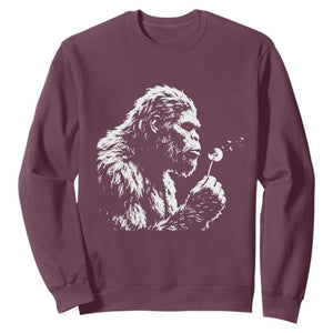 Bigfoot Blowing Dandelion Flower Graphic Sweatshirt Whimsical Sasquatch Profile Artistic Vintage Distressed TS02 Maroon Print Your Wear