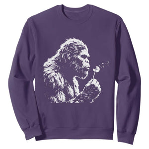 Bigfoot Blowing Dandelion Flower Graphic Sweatshirt Whimsical Sasquatch Profile Artistic Vintage Distressed TS02 Purple Print Your Wear