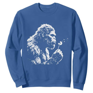 Bigfoot Blowing Dandelion Flower Graphic Sweatshirt Whimsical Sasquatch Profile Artistic Vintage Distressed TS02 Royal Blue Print Your Wear