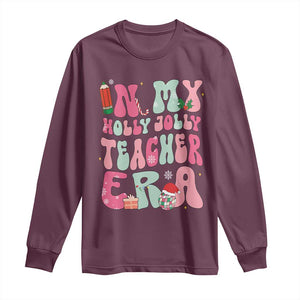 In My Holly Jolly Teacher Era Xmas Groovy Christmas Long Sleeve Shirt TS02 Maroon Print Your Wear