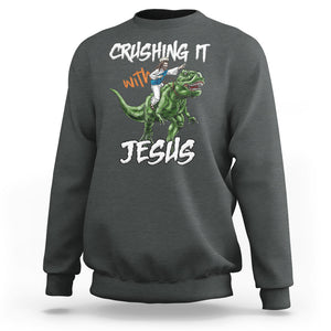 Crushing It With Jesus Sweatshirt Funny Riding Dinosaur TS02 Dark Heather Printyourwear