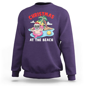 Funny Flamingo Float Santa Claus Christmas At The Beach Sweatshirt TS09 Purple Printyourwear