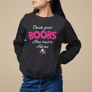 Breast Cancer Awareness Sweatshirt Check Your Boobs Mine Tries To Kill Me TS09 Black Print Your Wear