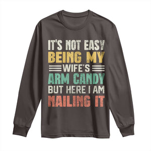 Funny Husband Long Sleeve Shirt It's Not Easy Being My Wife's Arm Candy TS09 Dark Chocolate Print Your Wear