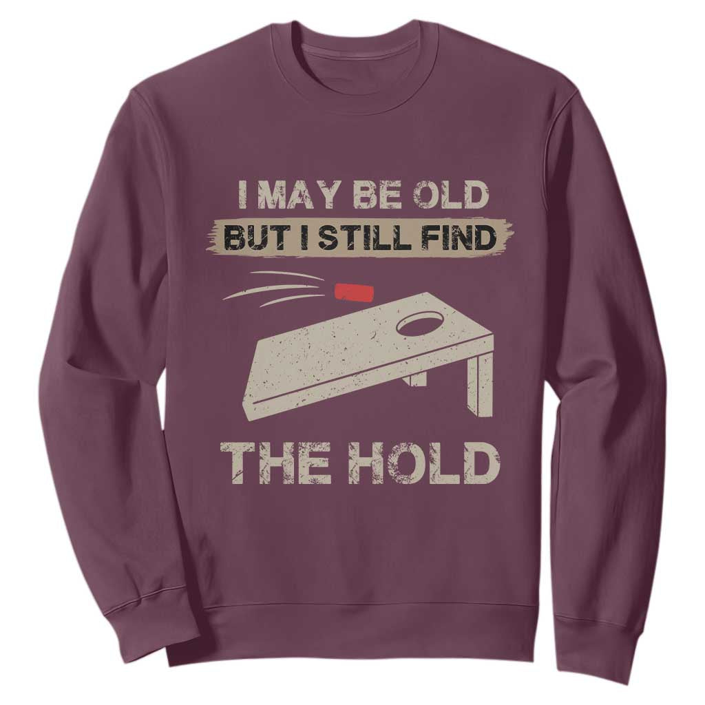 I May Be Old But I Still Find The Hole Cornhole Sweatshirt Funny Old Man Saying TS10 Maroon Print Your Wear