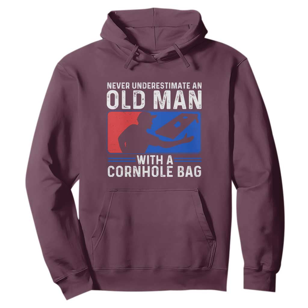 Funny Cornhole Player Hoodie Never Underestimate An Old Man With A Cornhole Bag TS10 Maroon Print Your Wear