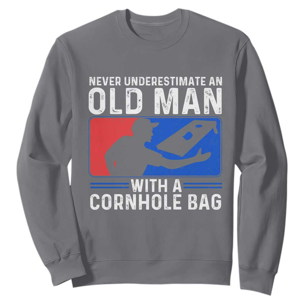 Funny Cornhole Player Sweatshirt Never Underestimate An Old Man With A Cornhole Bag TS10 Charcoal Print Your Wear