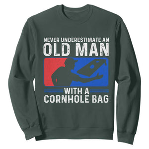 Funny Cornhole Player Sweatshirt Never Underestimate An Old Man With A Cornhole Bag TS10 Dark Forest Green Print Your Wear