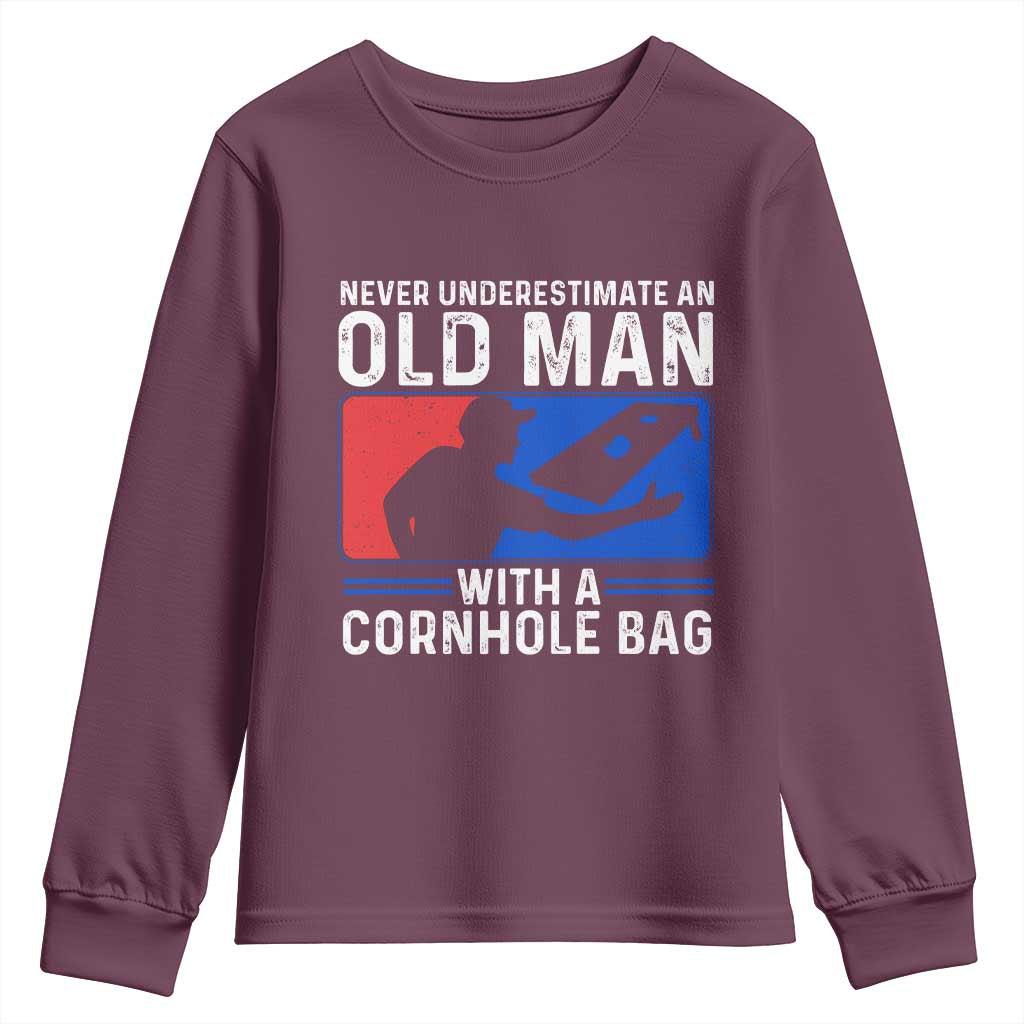 Funny Cornhole Player Youth Sweatshirt Never Underestimate An Old Man With A Cornhole Bag TS10 Maroon Print Your Wear
