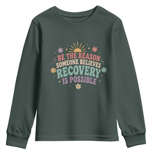 Be The Reason Someone Believes Recovery Is Possible Graphic Youth Sweatshirt Groovy Graphic TS10 Dark Forest Green Print Your Wear