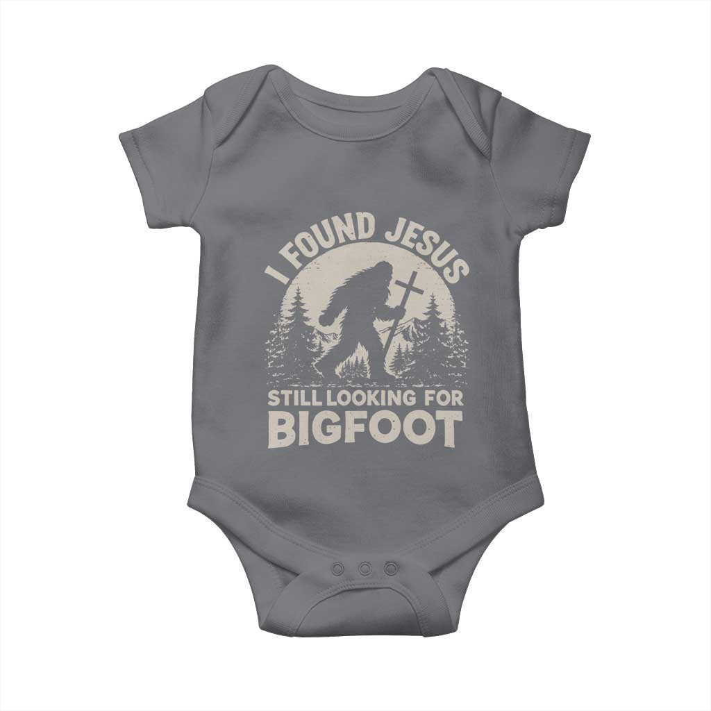 I Found Jesus Still Looking For Bigfoot Baby Onesie Funny Christian Sasquatch Forest TS11 Charcoal Print Your Wear
