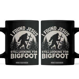 I Found Jesus Still Looking For Bigfoot Coffee Mug Funny Christian Sasquatch Forest TS11 Black Print Your Wear