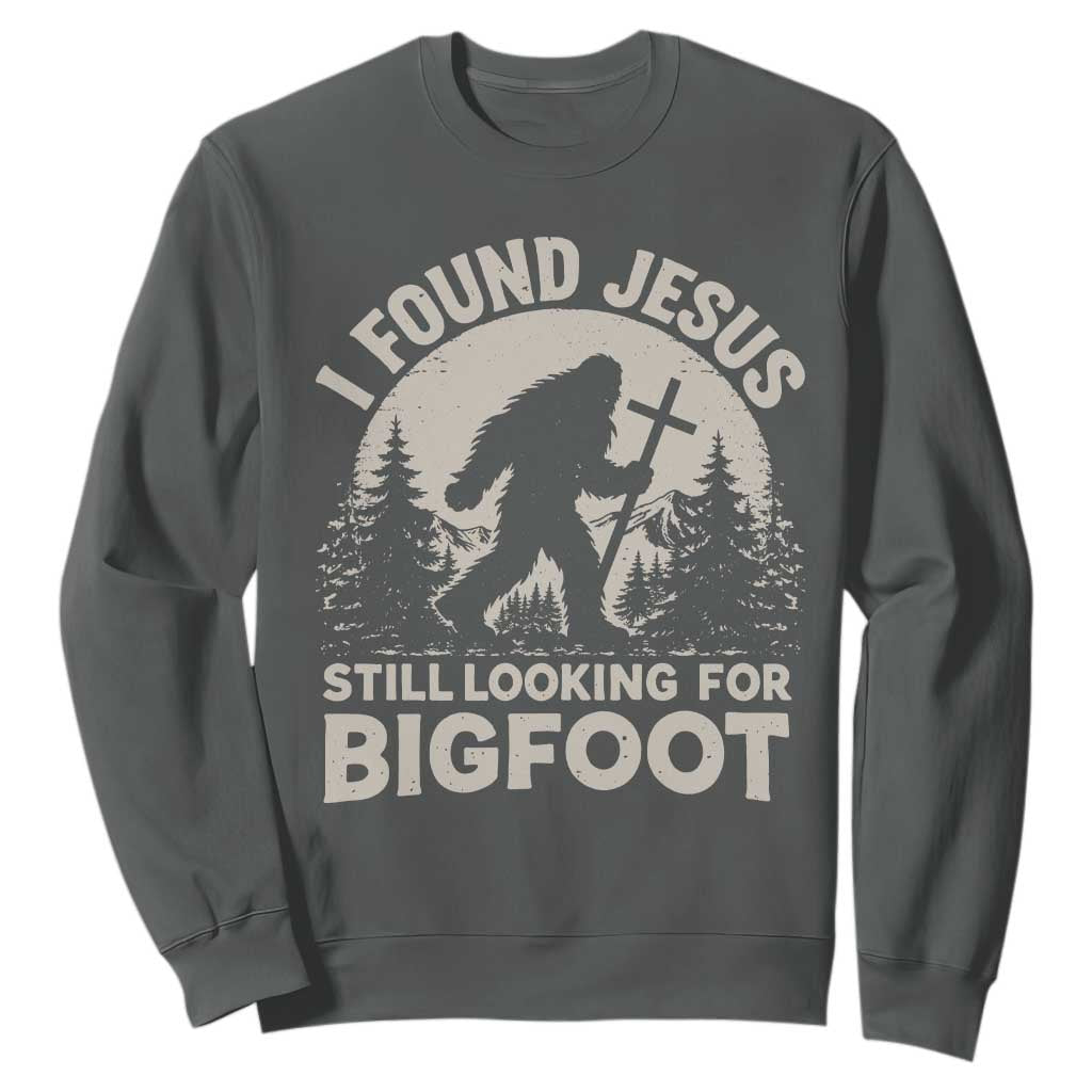 I Found Jesus Still Looking For Bigfoot Sweatshirt Funny Christian Sasquatch Forest TS11 Dark Heather Print Your Wear