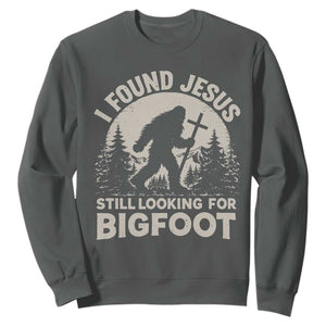 I Found Jesus Still Looking For Bigfoot Sweatshirt Funny Christian Sasquatch Forest TS11 Dark Heather Print Your Wear