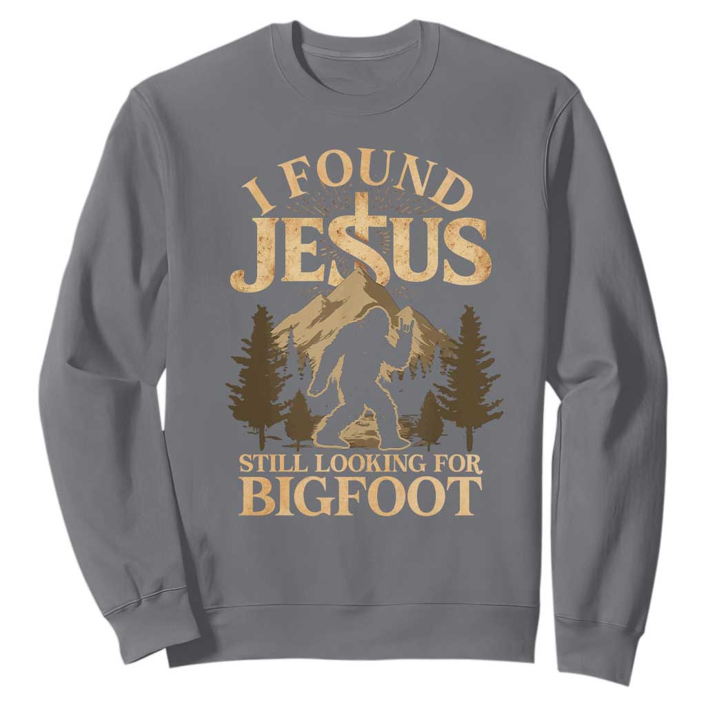I Found Jesus Still Looking For Bigfoot Sweatshirt Funny Christian Sasquatch Vintage Mountain TS11 Charcoal Print Your Wear