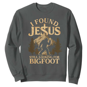 I Found Jesus Still Looking For Bigfoot Sweatshirt Funny Christian Sasquatch Vintage Mountain TS11 Dark Heather Print Your Wear