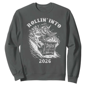 Funny Cowboy Raccoon Rollin Into 2026 Sweatshirt New Year Dumpster Fire 2026 Rodeo TS11 Dark Heather Print Your Wear