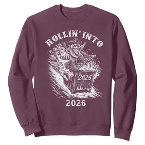 Funny Cowboy Raccoon Rollin Into 2026 Sweatshirt New Year Dumpster Fire 2026 Rodeo TS11 Maroon Print Your Wear