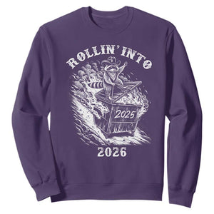 Funny Cowboy Raccoon Rollin Into 2026 Sweatshirt New Year Dumpster Fire 2026 Rodeo TS11 Purple Print Your Wear