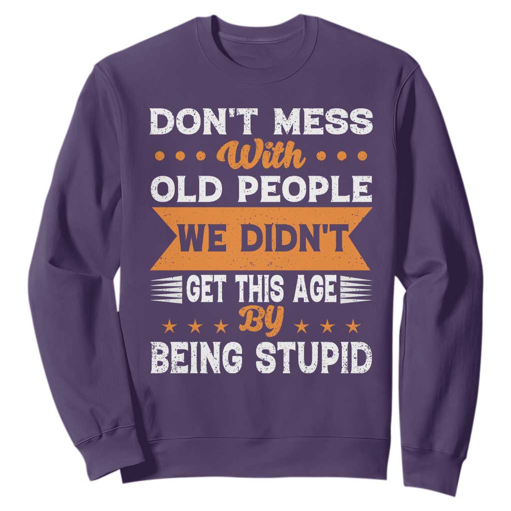 Funny Dont Mess With Old People We Didnt Get This Age By Being Stupid Sweatshirt TS11 Purple Print Your Wear