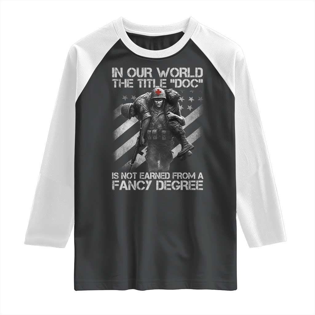 Combat Medic Raglan Shirt In Our World The Title Doc Is Not Earned Form A Fancy Degree TS11 Black White Print Your Wear