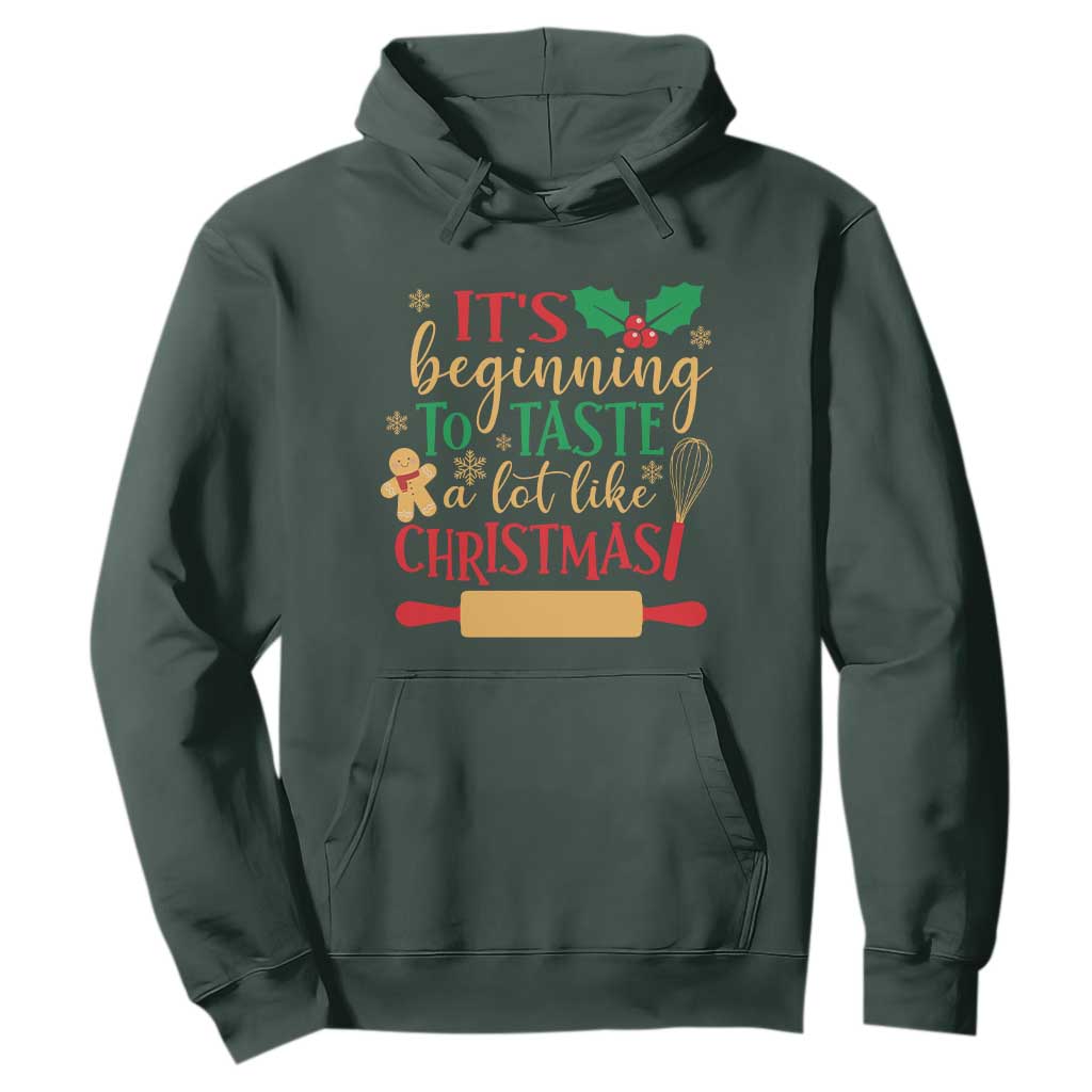 Funny Christmas Baker Hoodie It's Beginning To Taste A Lot Like Christmas Gingerbread TS11 Dark Forest Green Print Your Wear