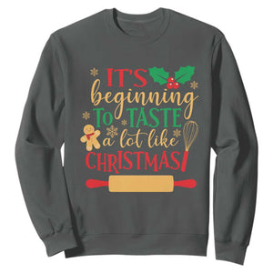 Funny Christmas Baker Sweatshirt It's Beginning To Taste A Lot Like Christmas Gingerbread TS11 Dark Heather Print Your Wear