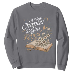 A New Chapter Begins Retired 2026 Sweatshirt Retired Teacher Floral Book TS11 Charcoal Print Your Wear