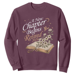 A New Chapter Begins Retired 2026 Sweatshirt Retired Teacher Floral Book TS11 Maroon Print Your Wear