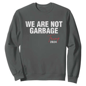 Funny Trump Garbage Sweatshirt We're Not Garbage Trump 2024 TS11 Dark Heather Print Your Wear