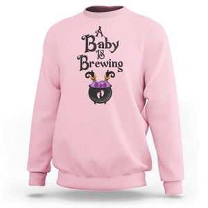 Funny Halloween Pregnancy Announcement Sweatshirt A Baby Is Brewing Witch Cauldron Footprint Pregnant Baby TS11 Light Pink Print Your Wear