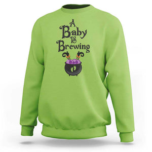 Funny Halloween Pregnancy Announcement Sweatshirt A Baby Is Brewing Witch Cauldron Footprint Pregnant Baby TS11 Lime Print Your Wear