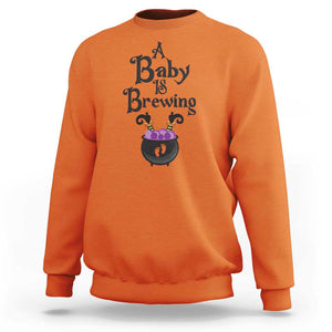 Funny Halloween Pregnancy Announcement Sweatshirt A Baby Is Brewing Witch Cauldron Footprint Pregnant Baby TS11 Orange Print Your Wear