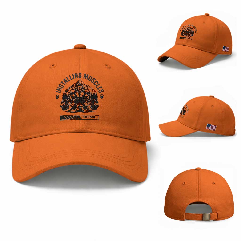 Installing Muscles Please Wait Baseball Cap Bigfoot Funny Gym Workout Gift TS12 Baseball Cap Universal Fit Orange Print Your Wear