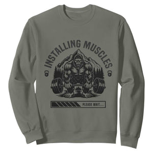 Installing Muscles Please Wait Sweatshirt Bigfoot Funny Gym Workout Gift TS12 Military Green Print Your Wear
