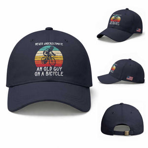 Never Underestimate An Old Guy On A Bicycle Baseball Cap Cycling Lover Gift TS12 Baseball Cap Universal Fit Navy Print Your Wear
