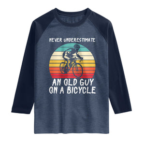 Never Underestimate An Old Guy On A Bicycle Raglan Shirt Cycling Lover Gift TS12 Heather Denim Navy Print Your Wear